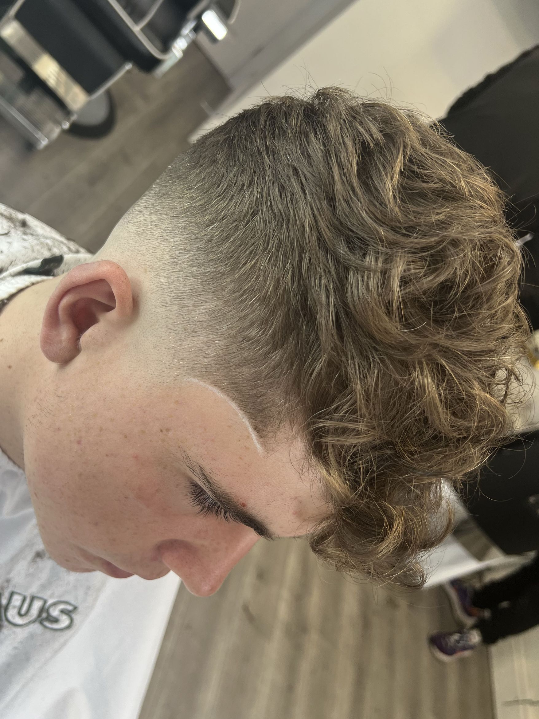 Curly top fade haircut